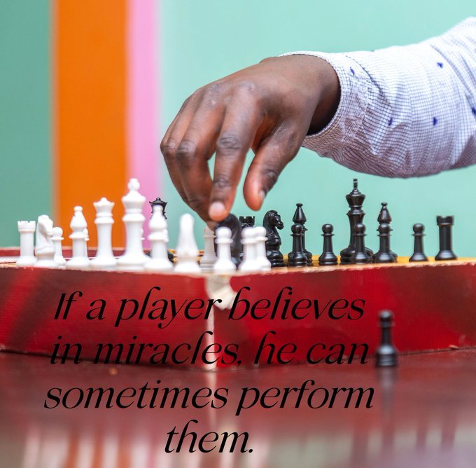 Hand moving a chess piece symbolizing strategy and self-care in addiction recovery aftercare in Kenya.