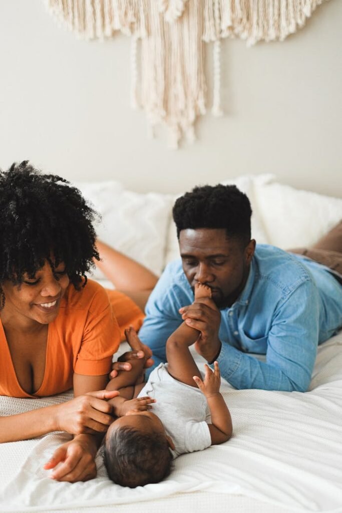 A happy family enjoying quality time together with their baby indoors.